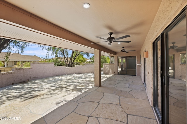 view of patio featuring ceiling fan