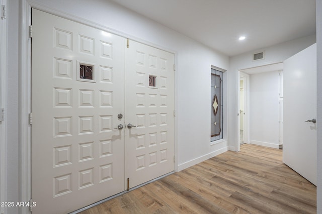 entrance foyer featuring light hardwood / wood-style floors