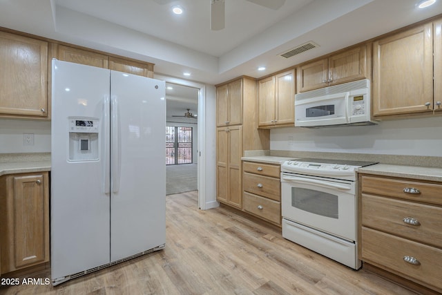 kitchen with ceiling fan, white appliances, light brown cabinetry, and light wood-type flooring