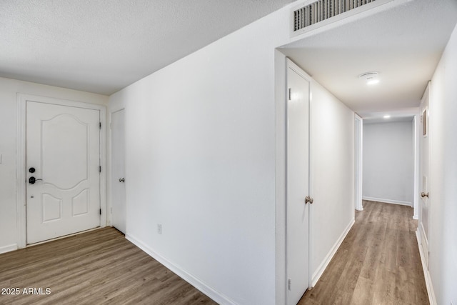 3801 E Captain Dreyfus Ave, Phoenix, AZ 85032 - entrance foyer with wood finished floors and a textured ceiling