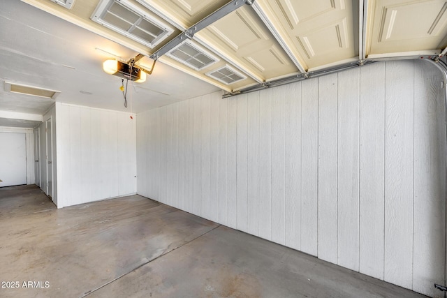 3801 E Captain Dreyfus Ave, Phoenix, AZ 85032 - garage featuring a garage door opener and wood walls