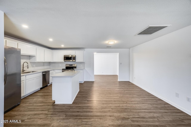 3801 E Captain Dreyfus Ave, Phoenix, AZ 85032 - kitchen with stainless steel appliances, backsplash, white cabinetry, light countertops, and recessed lighting