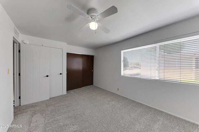4630 N 68th St Unit 280, Scottsdale, AZ 85251 - unfurnished bedroom featuring carpet floors and a ceiling fan