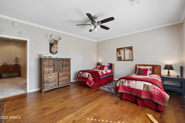 bedroom with ceiling fan, wood finished floors, visible vents, baseboards, and ornamental molding