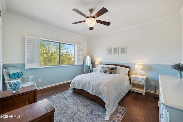 bedroom with dark wood-type flooring, crown molding, and baseboards