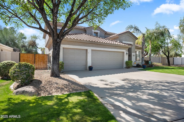 mediterranean / spanish-style house with a garage, driveway, a tiled roof, and stucco siding