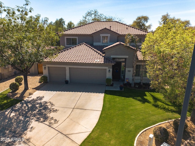 mediterranean / spanish-style home with stucco siding, concrete driveway, a garage, a tiled roof, and a front lawn