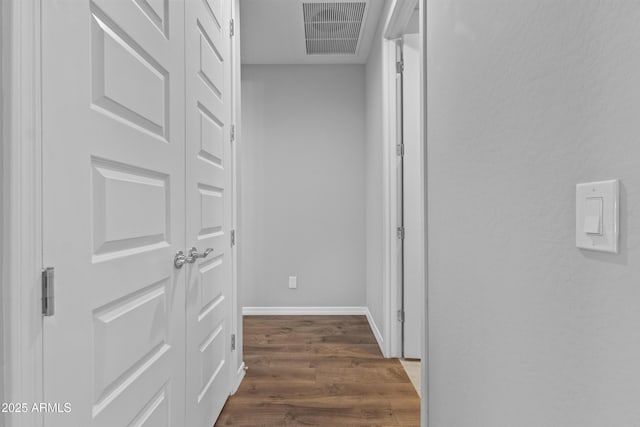 19203 W Jackson St, Buckeye, AZ 85326 - hallway featuring dark wood finished floors and baseboards