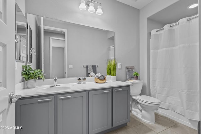 19203 W Jackson St, Buckeye, AZ 85326 - full bathroom featuring tile patterned flooring, vanity, toilet, and shower / tub combo with curtain