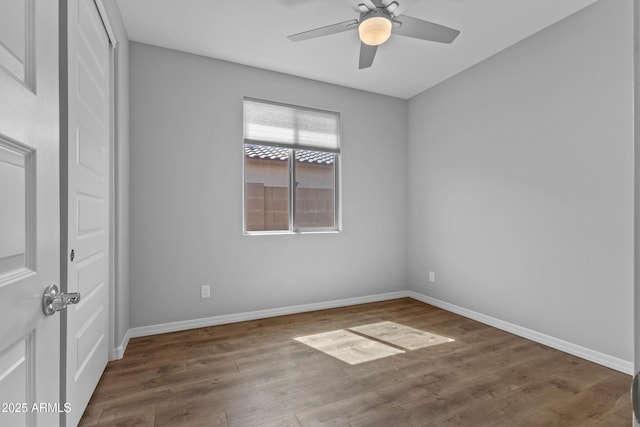 19203 W Jackson St, Buckeye, AZ 85326 - unfurnished room featuring wood finished floors, baseboards, and a ceiling fan