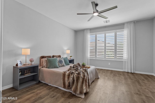 19203 W Jackson St, Buckeye, AZ 85326 - bedroom featuring wood finished floors, baseboards, and ceiling fan