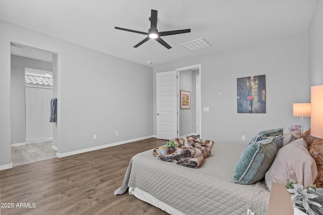 19203 W Jackson St, Buckeye, AZ 85326 - bedroom featuring wood finished floors, baseboards, ensuite bathroom, and ceiling fan