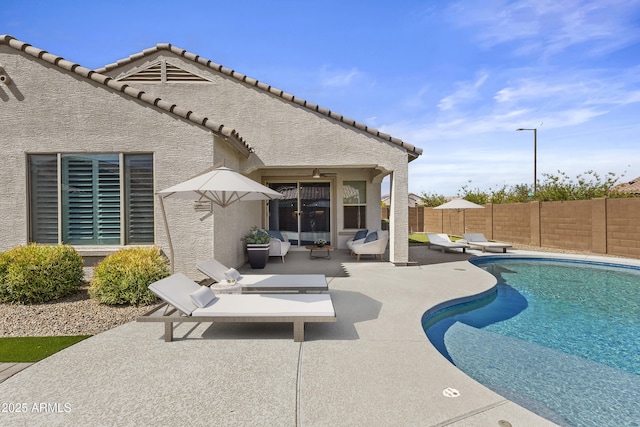 19203 W Jackson St, Buckeye, AZ 85326 - view of pool featuring a fenced backyard, a patio, and an outdoor living space