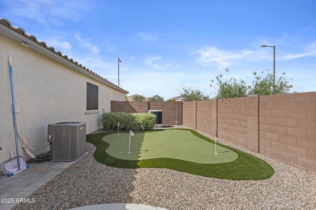 19203 W Jackson St, Buckeye, AZ 85326 - fenced backyard featuring a putting green and central air condition unit