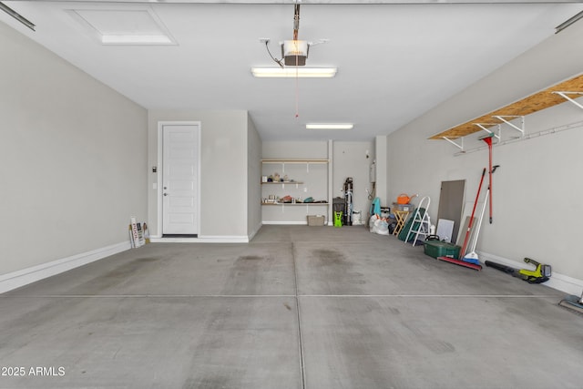 19203 W Jackson St, Buckeye, AZ 85326 - garage with a garage door opener and baseboards