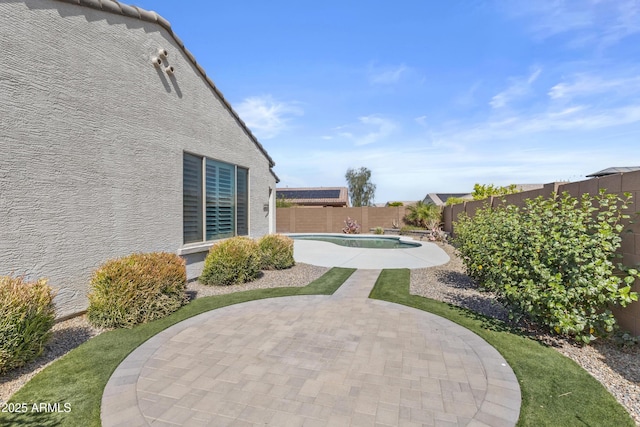 19203 W Jackson St, Buckeye, AZ 85326 - fenced backyard with a patio area