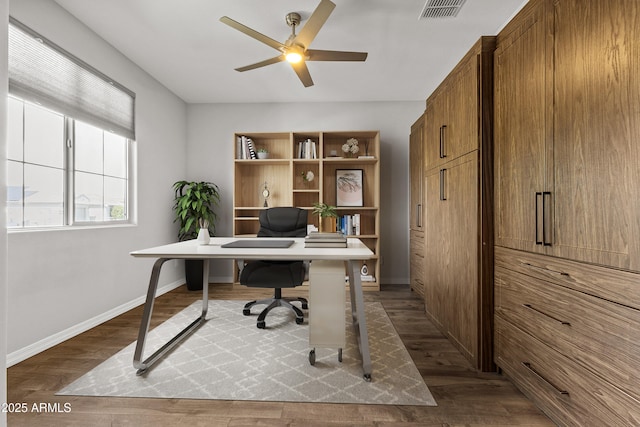 19203 W Jackson St, Buckeye, AZ 85326 - office with dark wood-type flooring, baseboards, and a ceiling fan