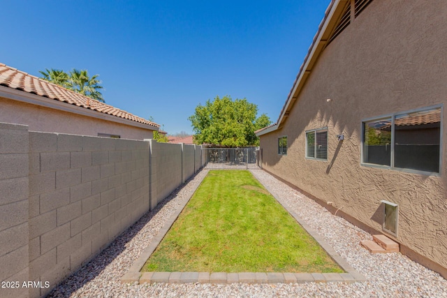 view of yard with a fenced backyard