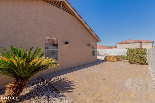 view of patio with a fenced backyard