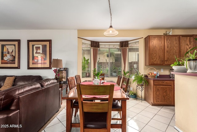 dining area with light tile patterned floors