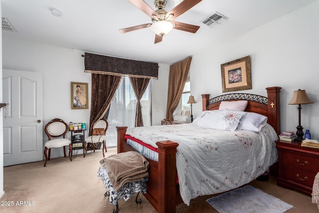 carpeted bedroom with ceiling fan and visible vents