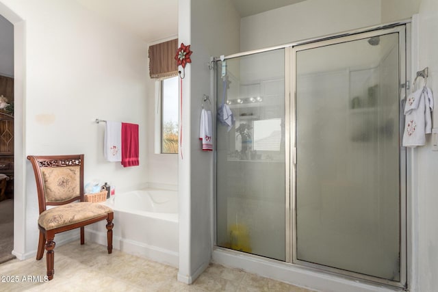 full bathroom featuring a stall shower and a bath