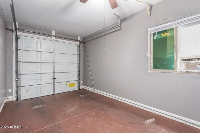 garage with ceiling fan, baseboards, and cooling unit