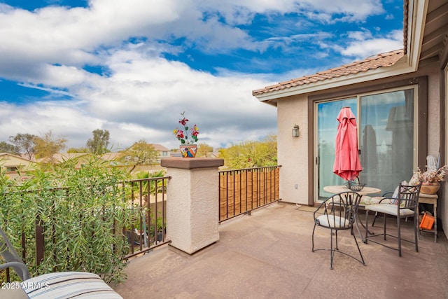 view of patio / terrace with a balcony