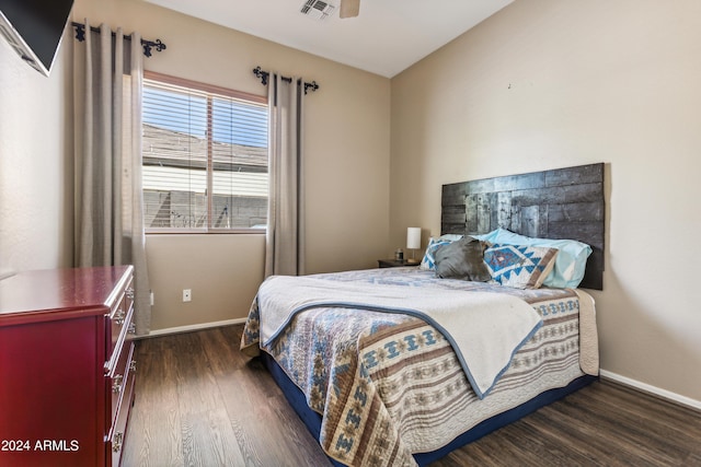 bedroom featuring ceiling fan, lofted ceiling, and dark hardwood / wood-style flooring