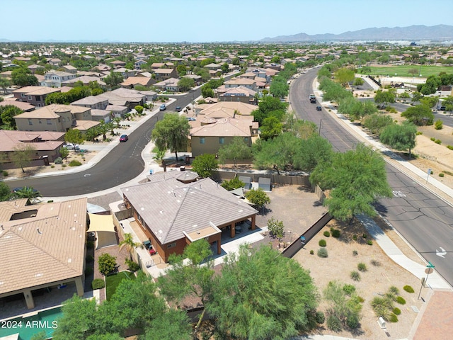 birds eye view of property with a mountain view