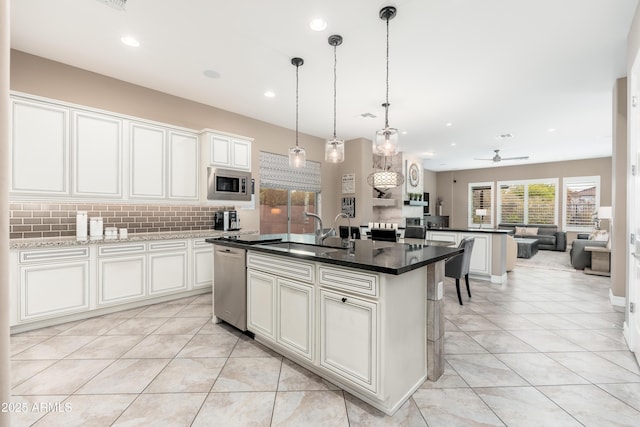 5428 E Windstone Trl, Cave Creek, AZ 85331 - kitchen with a sink, appliances with stainless steel finishes, ceiling fan, decorative backsplash, and light tile patterned flooring