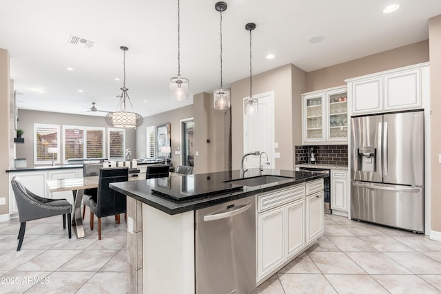 5428 E Windstone Trl, Cave Creek, AZ 85331 - kitchen with stainless steel appliances, a sink, an island with sink, backsplash, and recessed lighting