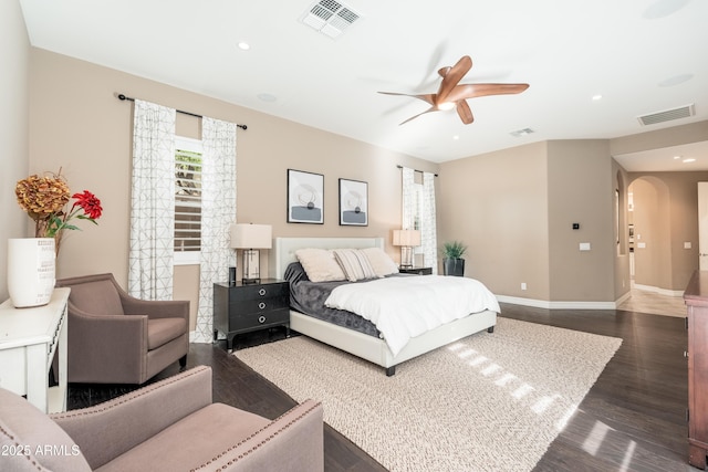 5428 E Windstone Trl, Cave Creek, AZ 85331 - bedroom featuring arched walkways, dark wood finished floors, baseboards, recessed lighting, and ceiling fan