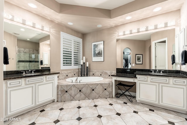 5428 E Windstone Trl, Cave Creek, AZ 85331 - bathroom with recessed lighting, a stall shower, two vanities, a garden tub, and tile patterned flooring