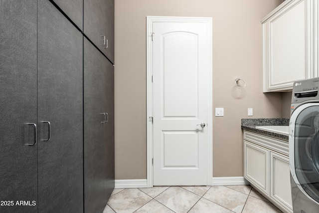 5428 E Windstone Trl, Cave Creek, AZ 85331 - washroom featuring cabinet space, washer / dryer, light tile patterned floors, and baseboards