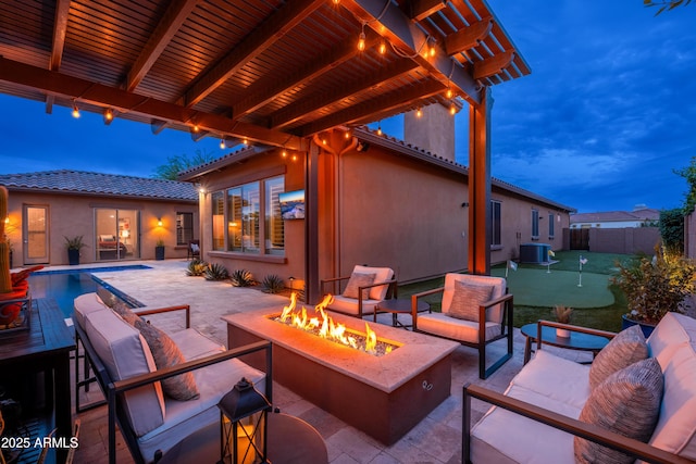 5428 E Windstone Trl, Cave Creek, AZ 85331 - view of patio / terrace with a putting green, central air condition unit, and an outdoor living space with a fire pit