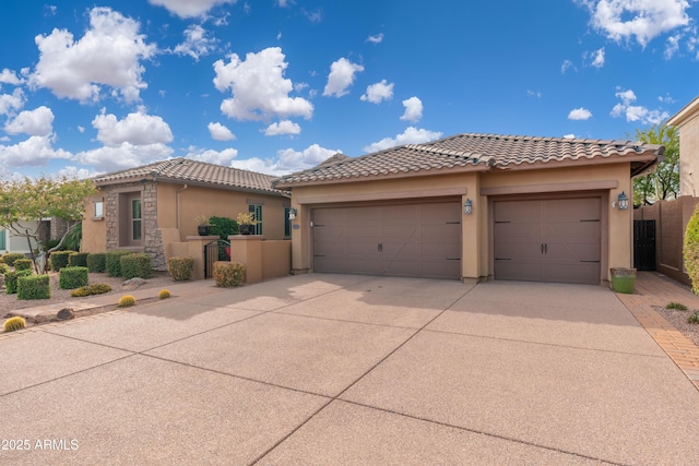 5428 E Windstone Trl, Cave Creek, AZ 85331 - view of front of property featuring concrete driveway, stucco siding, an attached garage, and a tile roof