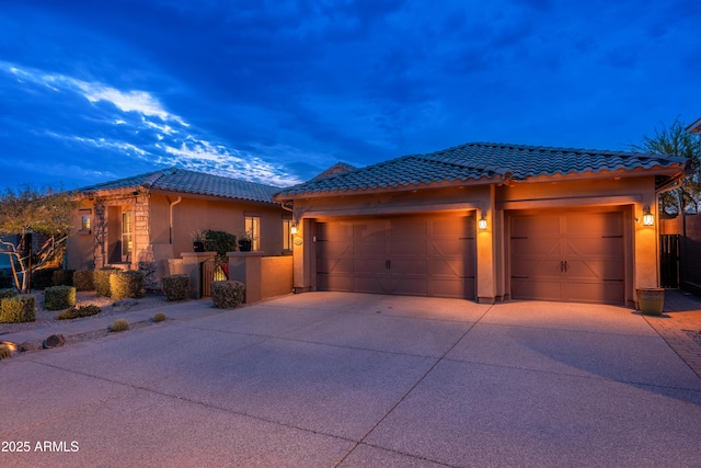 5428 E Windstone Trl, Cave Creek, AZ 85331 - view of front of property featuring an attached garage, concrete driveway, a tile roof, and stucco siding