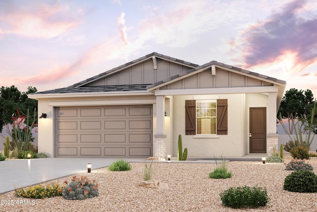 single story home with stucco siding, board and batten siding, an attached garage, and driveway