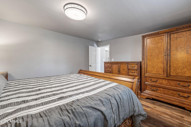 bedroom with hardwood / wood-style flooring