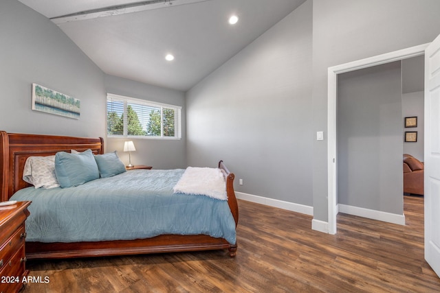 bedroom featuring vaulted ceiling and dark hardwood / wood-style flooring