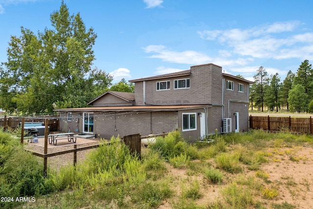 rear view of house featuring a patio area