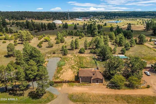 birds eye view of property with a rural view