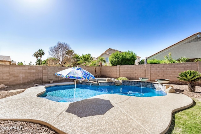 13020 W Highland Ave, Litchfield Park, AZ 85340 - view of pool featuring a fenced backyard, a pool with connected hot tub, and a patio area