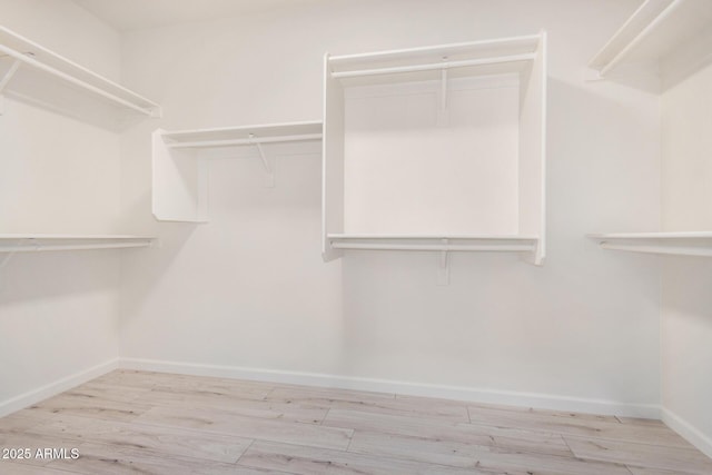 13020 W Highland Ave, Litchfield Park, AZ 85340 - walk in closet featuring wood finished floors