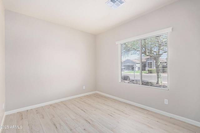 13020 W Highland Ave, Litchfield Park, AZ 85340 - unfurnished room featuring wood finished floors and baseboards