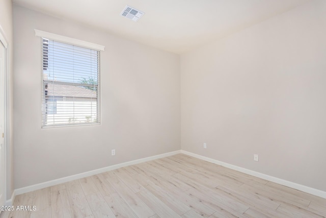 13020 W Highland Ave, Litchfield Park, AZ 85340 - empty room with light wood-style flooring and baseboards