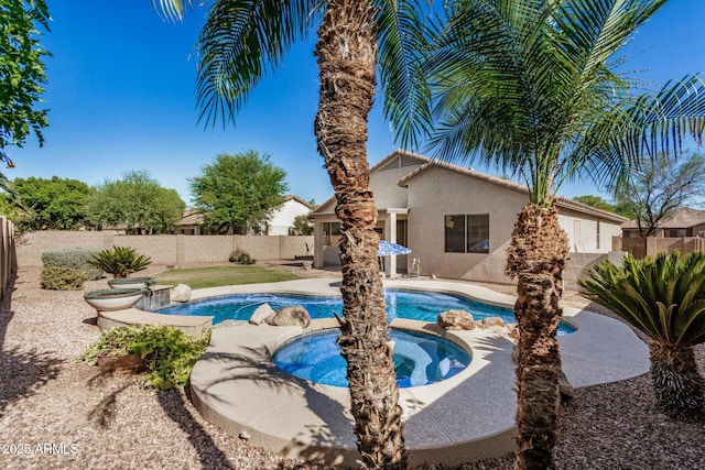 13020 W Highland Ave, Litchfield Park, AZ 85340 - view of pool featuring a fenced backyard, a pool with connected hot tub, and a patio area