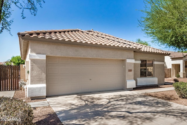 13020 W Highland Ave, Litchfield Park, AZ 85340 - view of front facade with stucco siding, a garage, concrete driveway, and a tiled roof