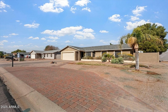 single story home with a garage